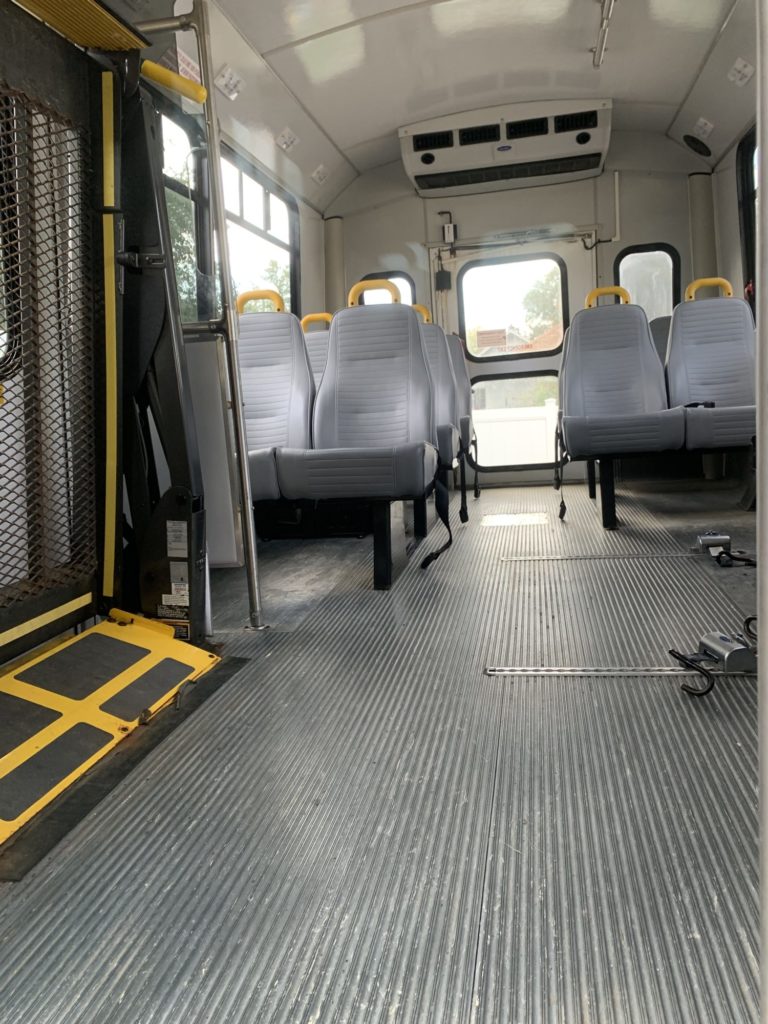 Interior of empty accessible city bus.