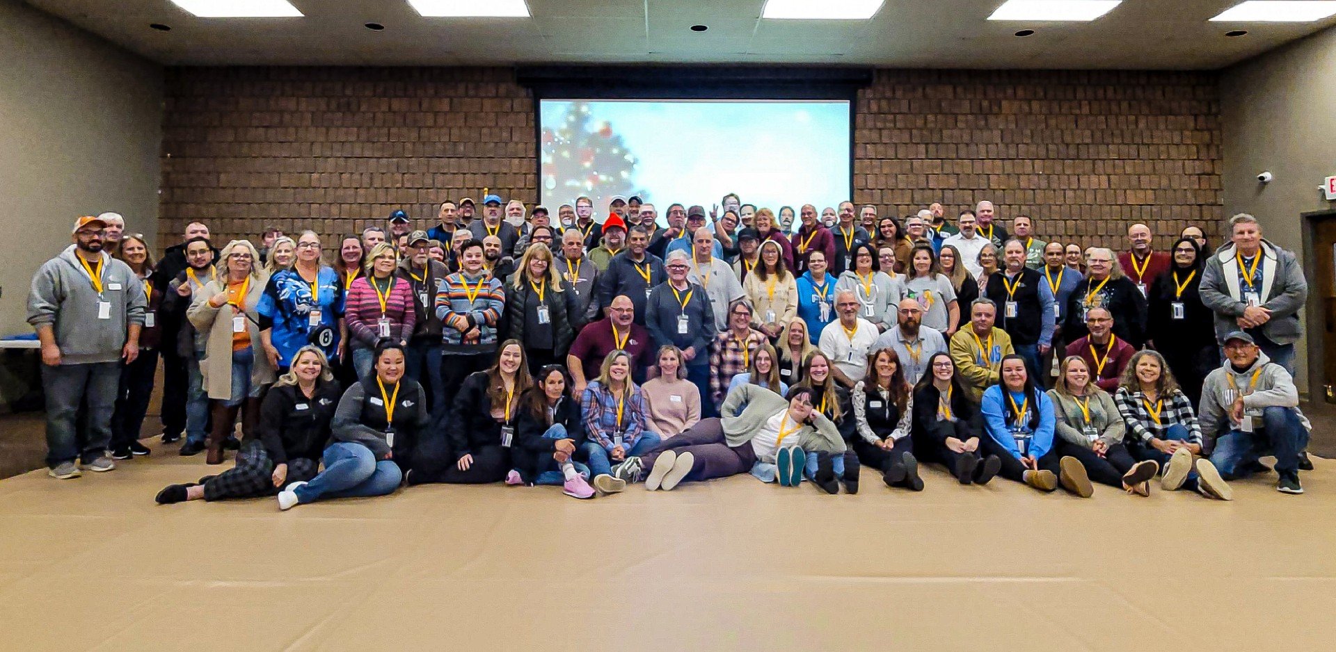 Large diverse group of smiling people in a conference hall